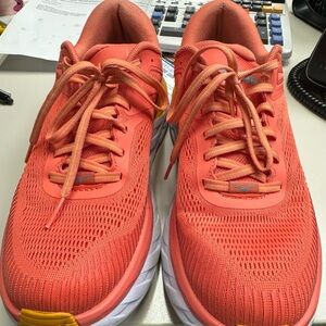 Hoka women’s tennis shoes, size 9, orange, smoke free.
